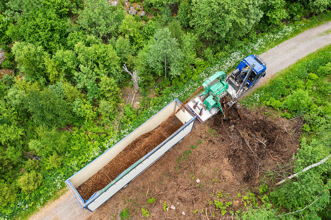 High angle view of dirt being load on trailer
