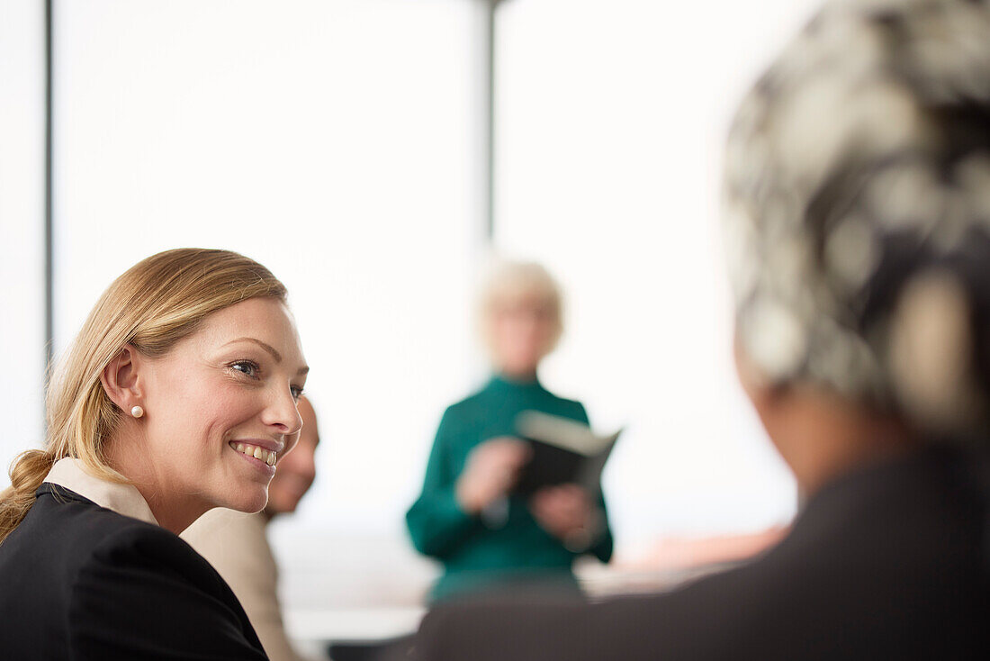 Smiling businesswoman at business meeting