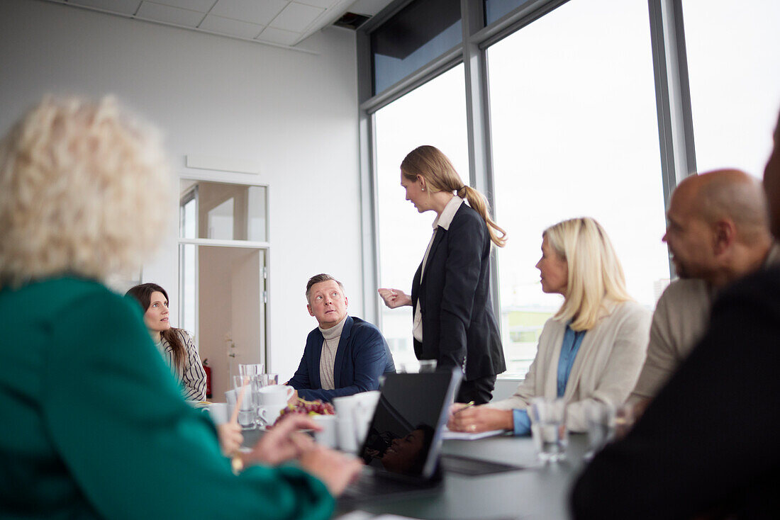 Woman talking during business meeting