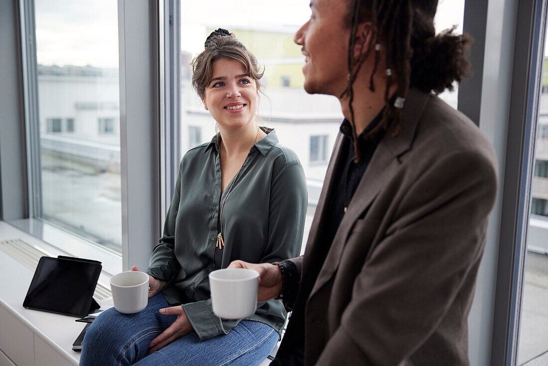 Business people having coffee break in office