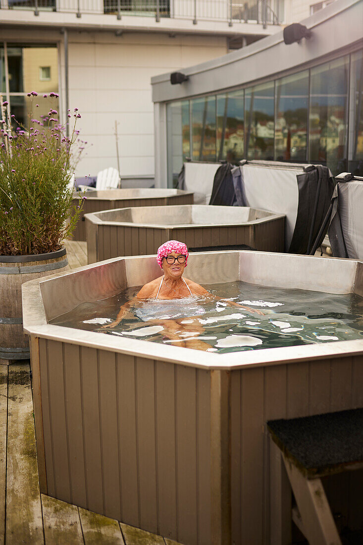 Senior woman relaxing in hot tub