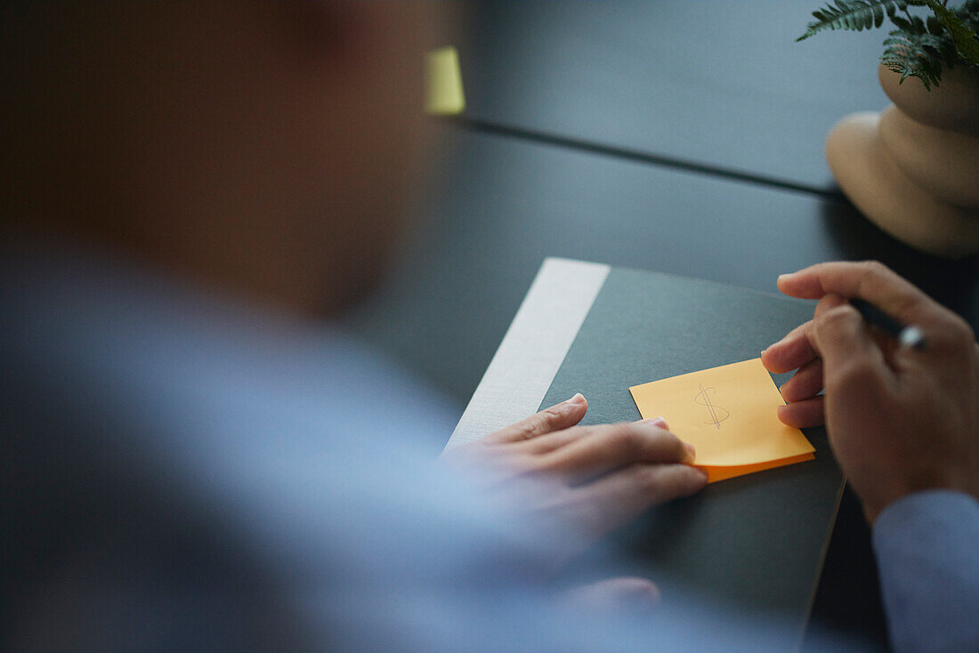 Man taking notes during meeting