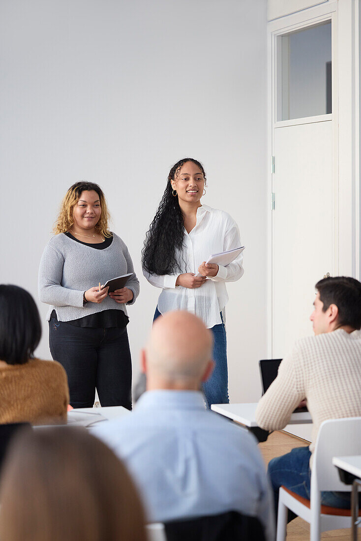 Business people having business seminar