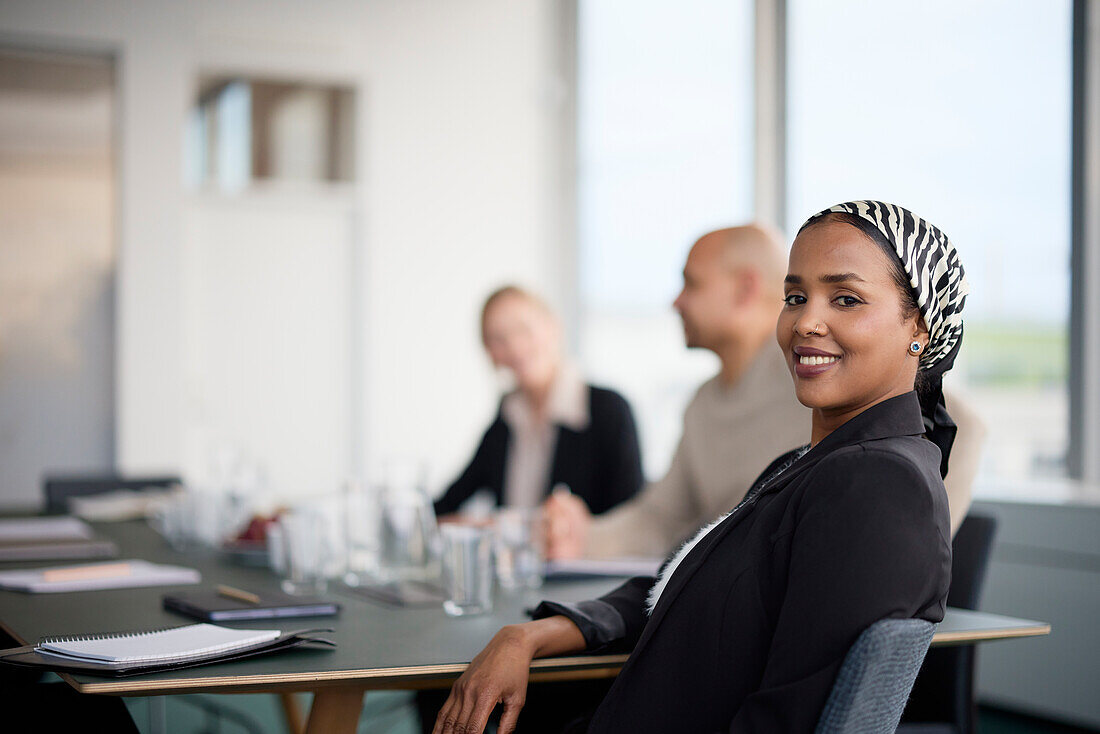 Smiling woman at business meeting