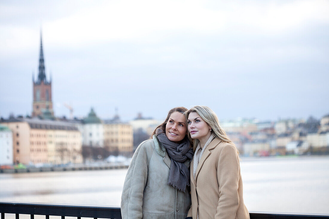 Mother with adult daughter in urban setting