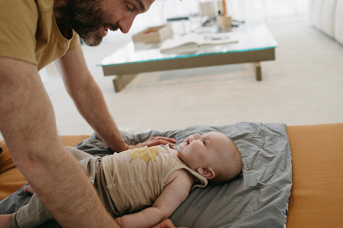 Father playing with baby