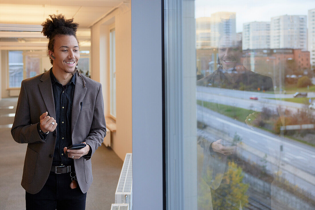 Smiling man standing in office