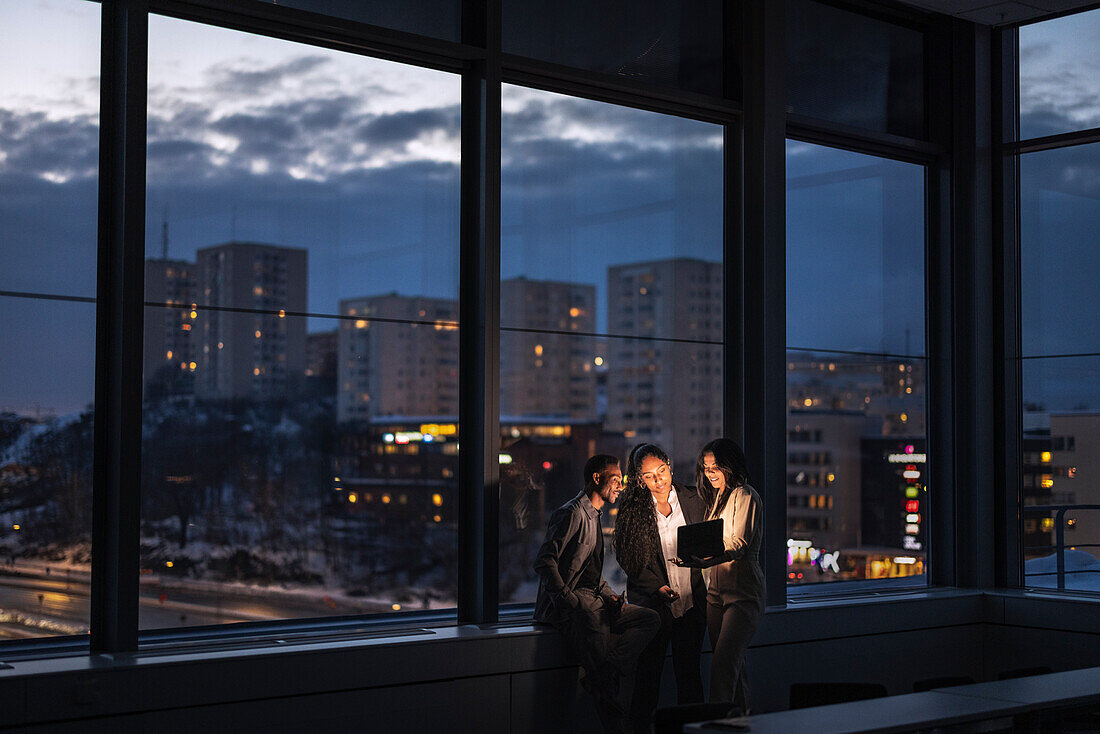 Business people working late in office