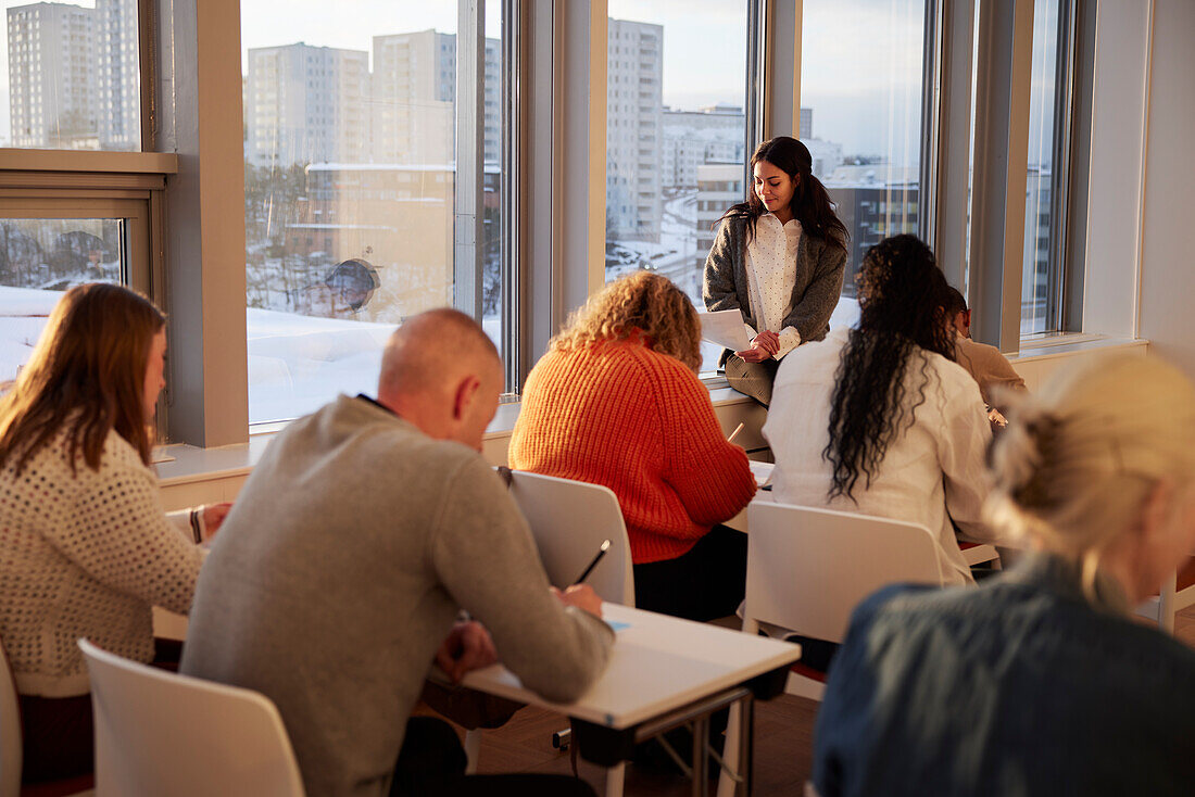 Teacher and adult students in class