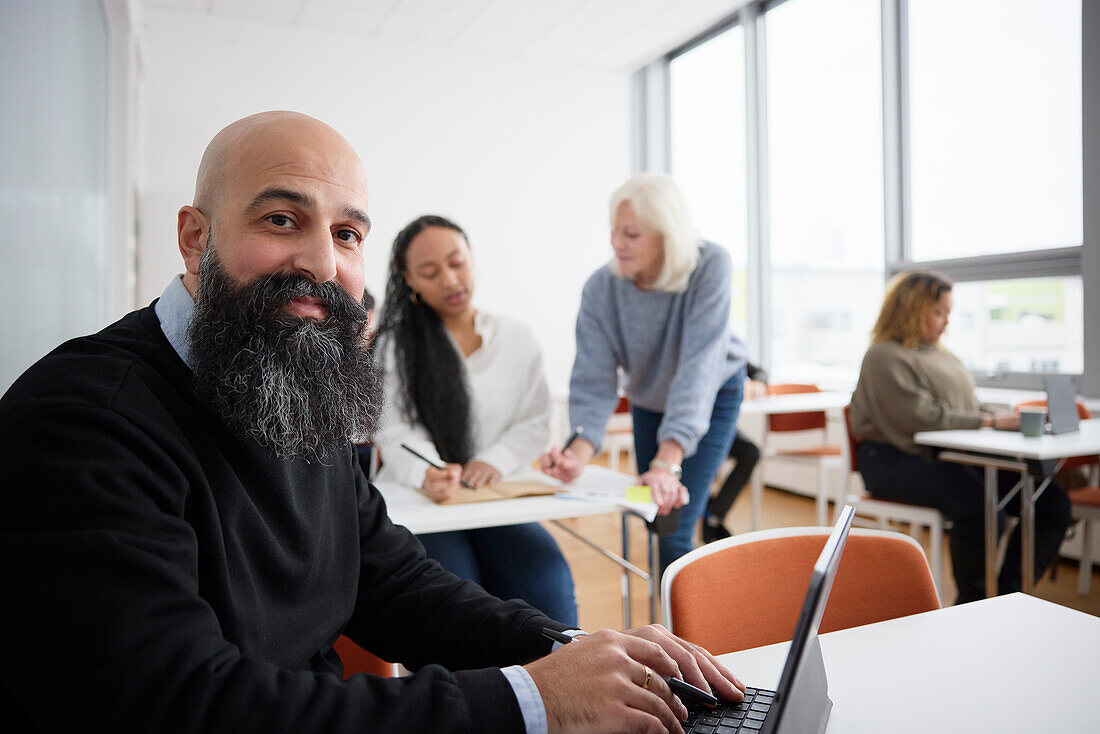 Portrait of smiling man in class