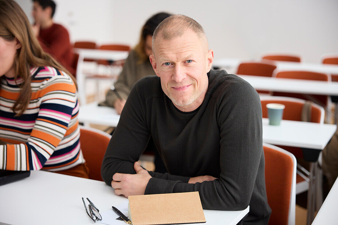 Portrait of smiling man in class