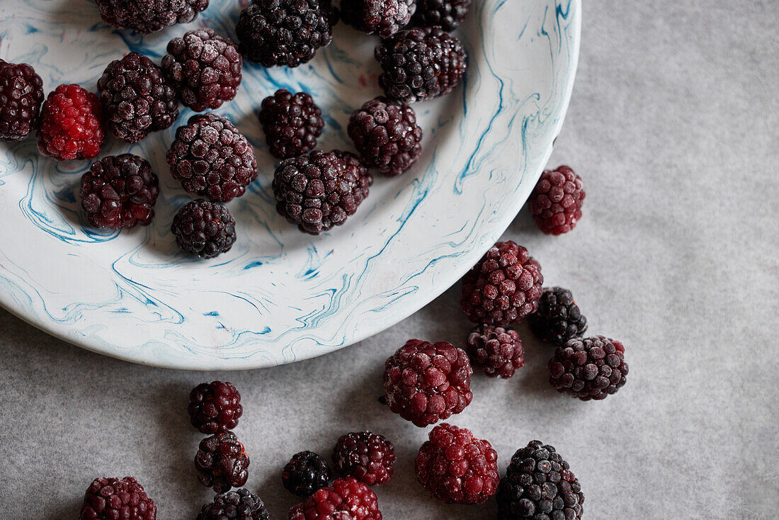 Close-up of frozen blackberries on plate