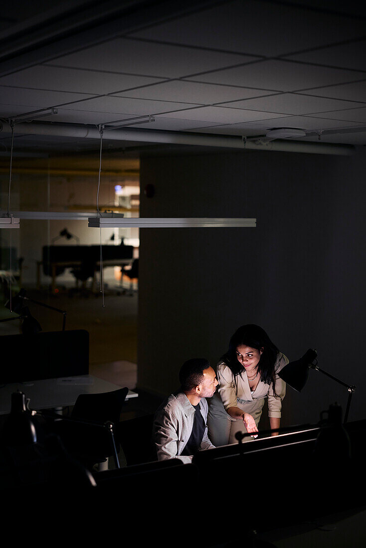 People working late in office