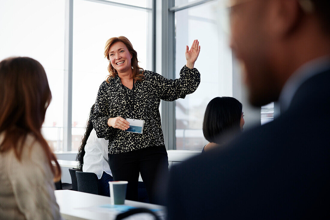 Businesswoman presenting before colleagues during meeting