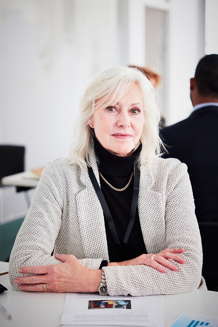 Portrait of senior businesswoman sitting at desk