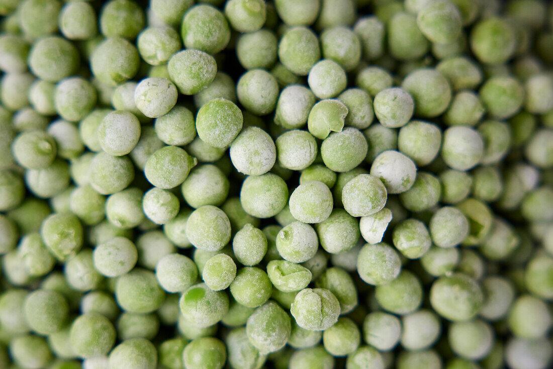 Close-up of pile of green peas