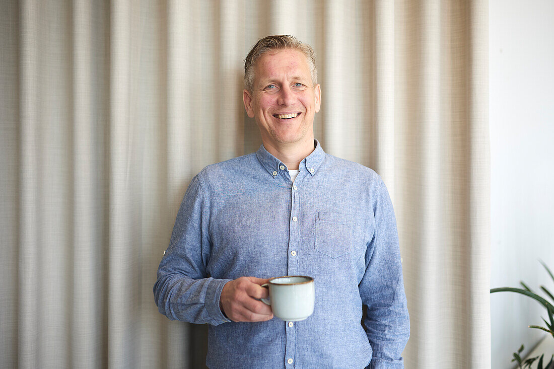 Smiling businessman looking at camera