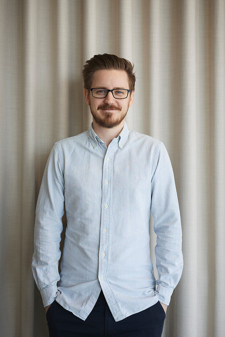 Smiling businessman looking at camera