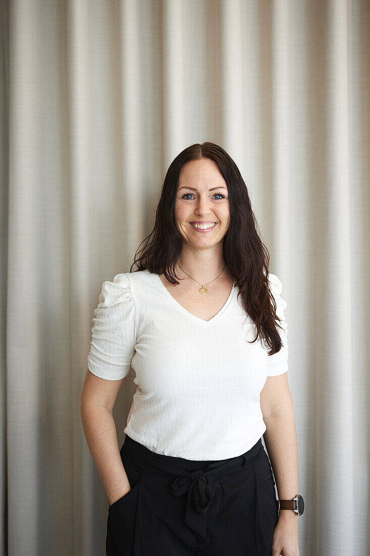 Smiling businesswoman looking at camera