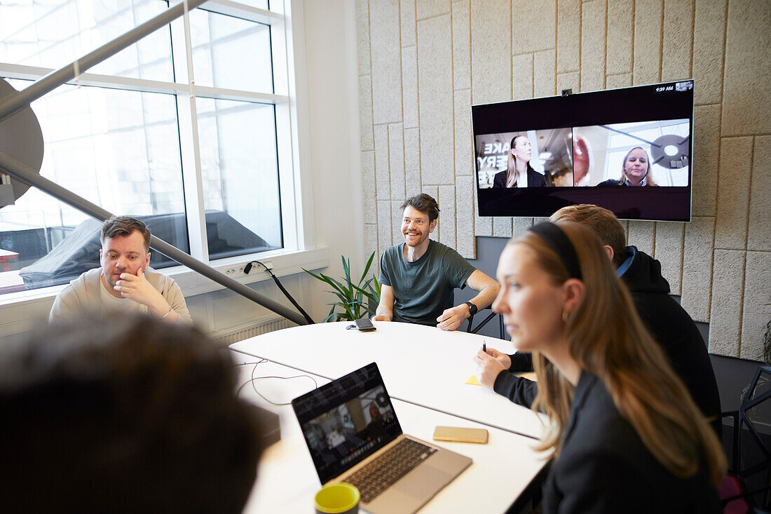 Smiling people at business meeting