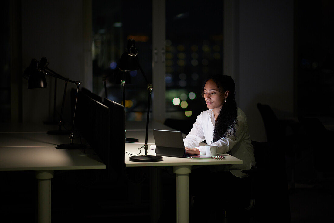 Woman working late in office