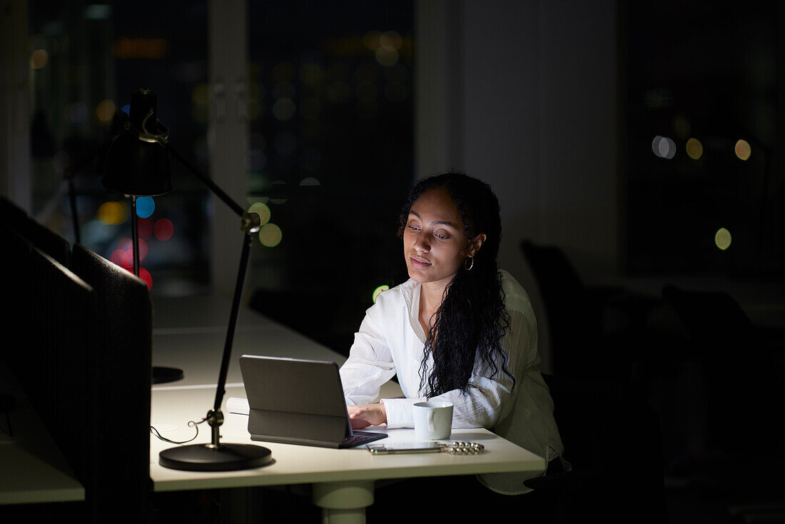 Woman working late in office