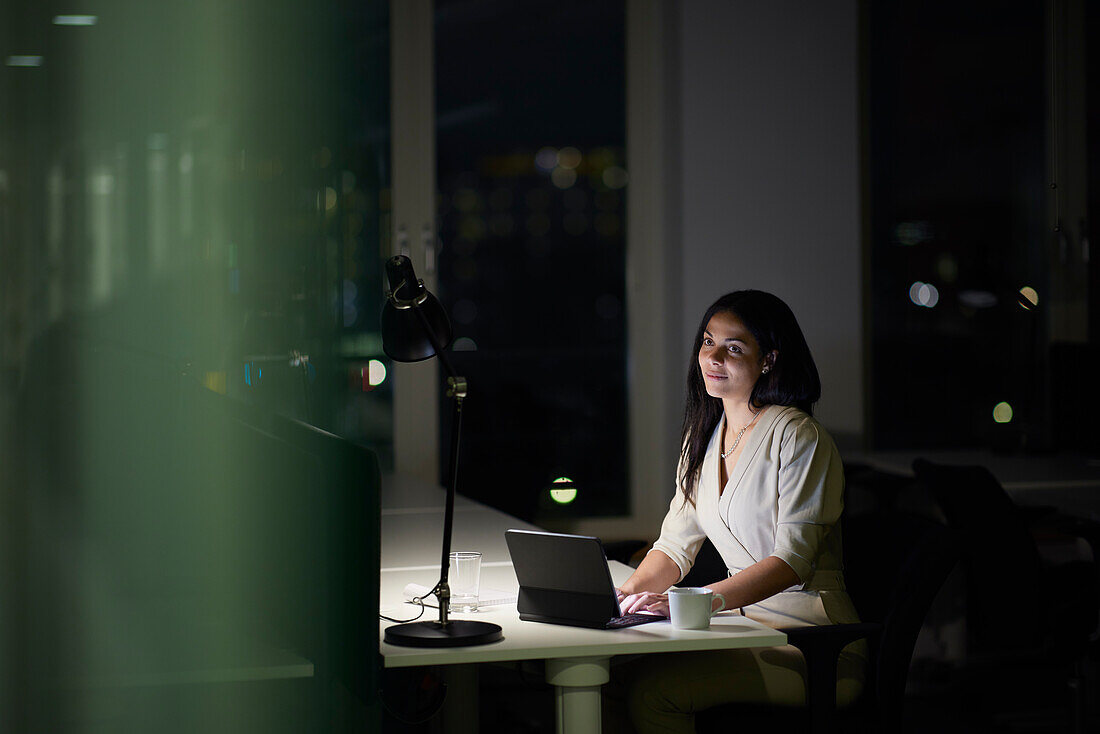 Woman working late in office