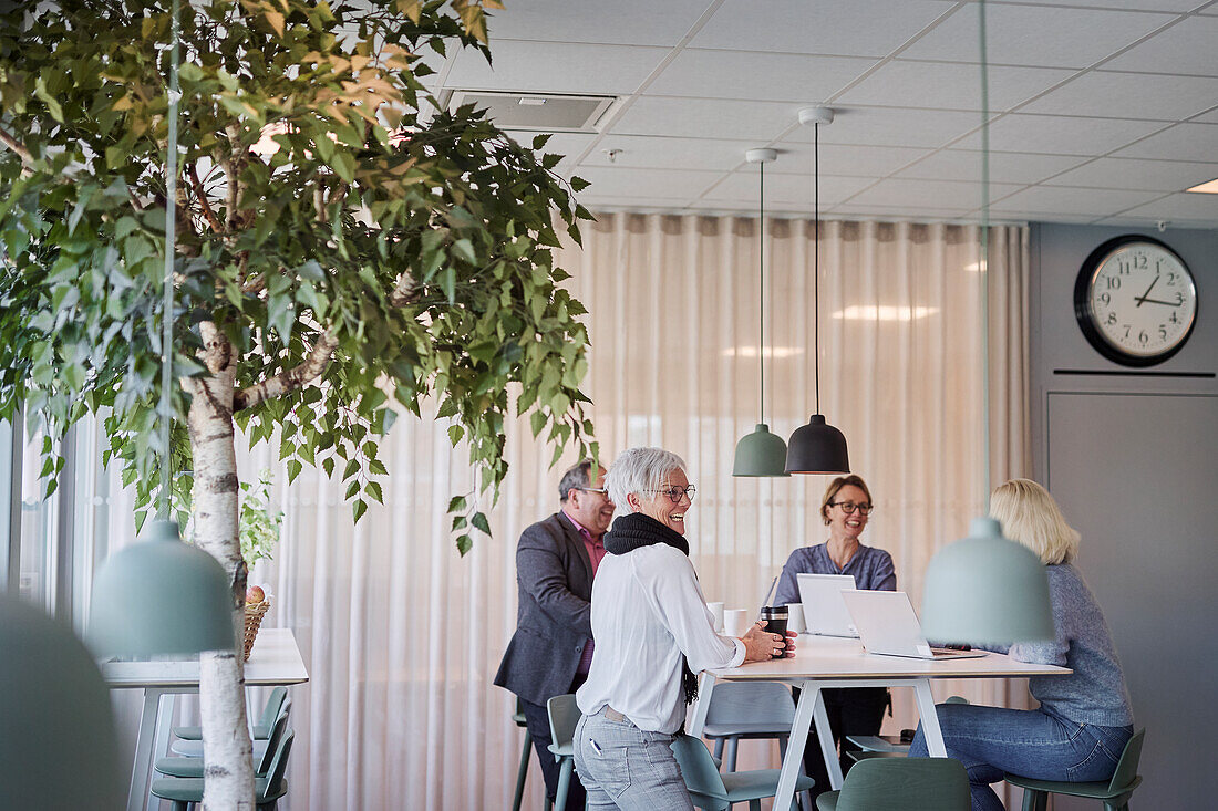 People taking during business meeting