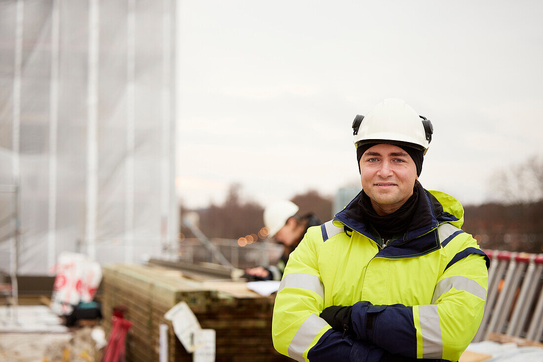 Engineer standing at building site