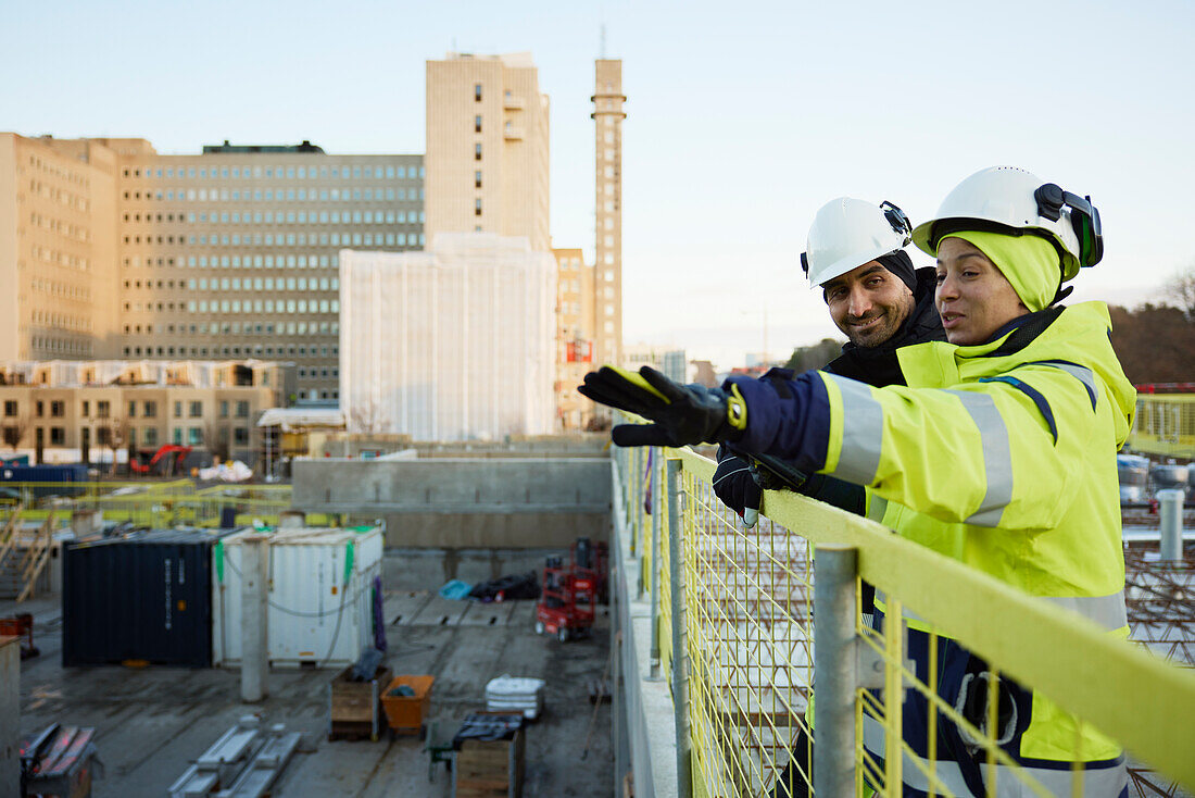 Two engineers working at construction site