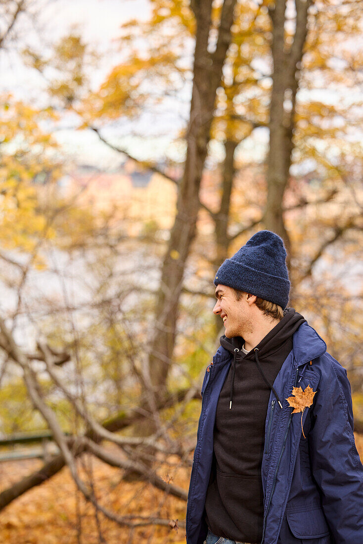 Smiling young man looking away