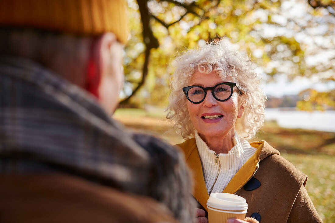 Senior woman holding coffee cup