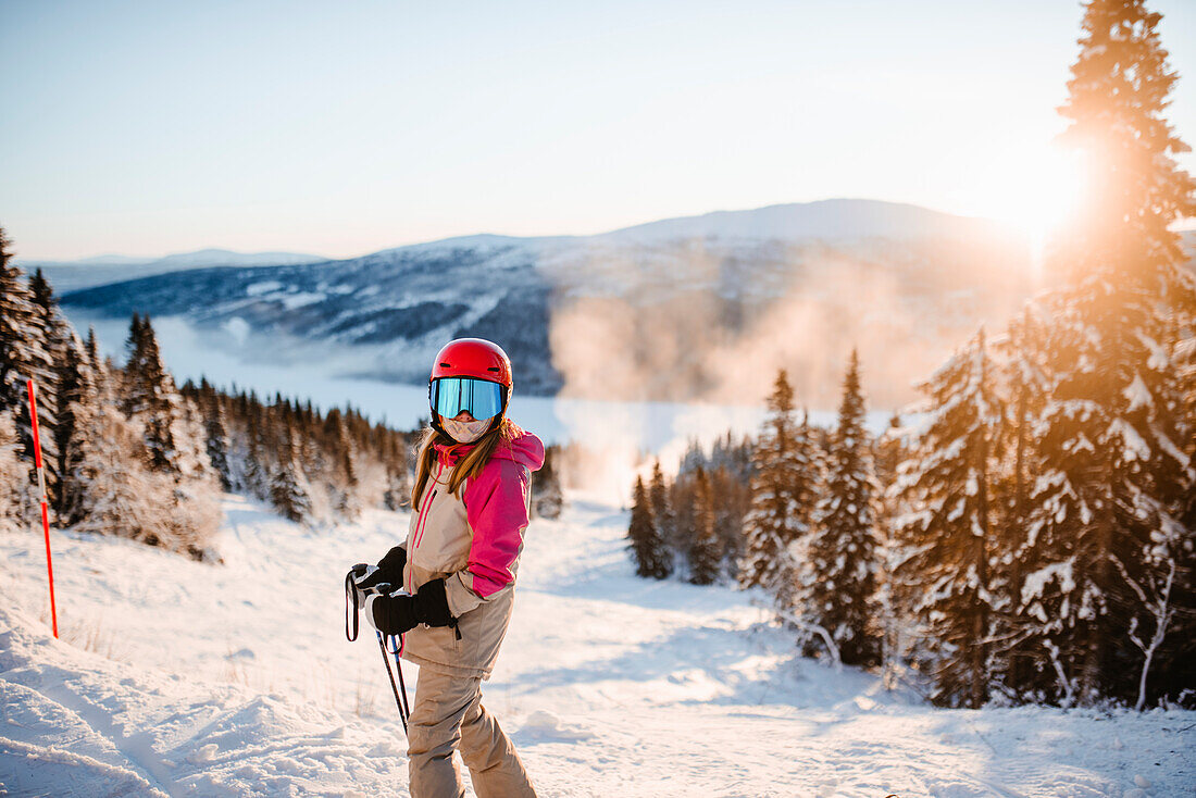 View of girl on ski slope