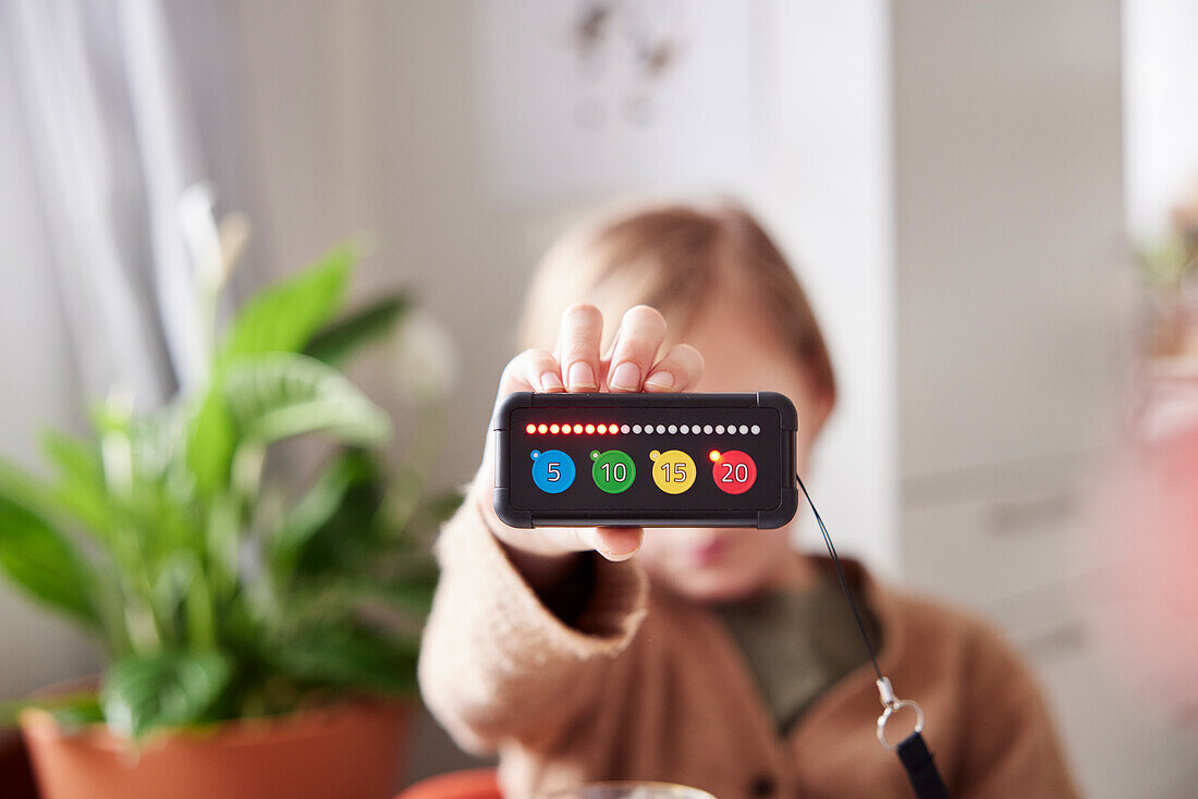 Child holding educational electronic game