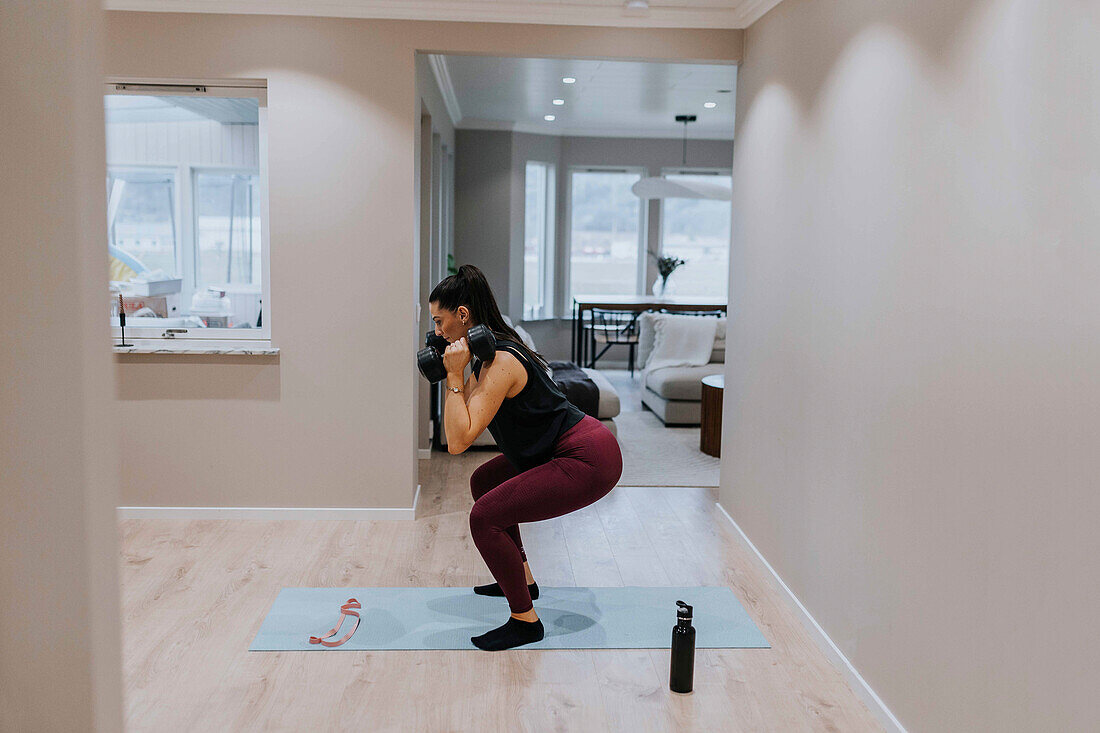 View of woman exercising at home