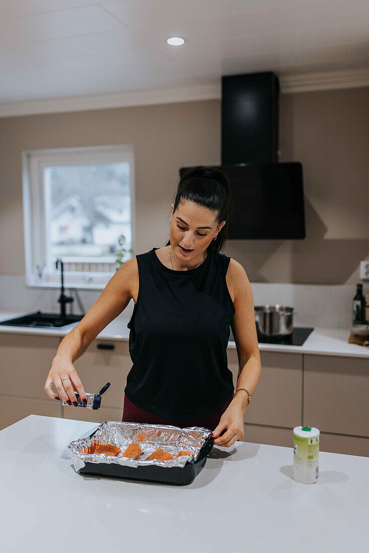 Woman preparing food in kitchen