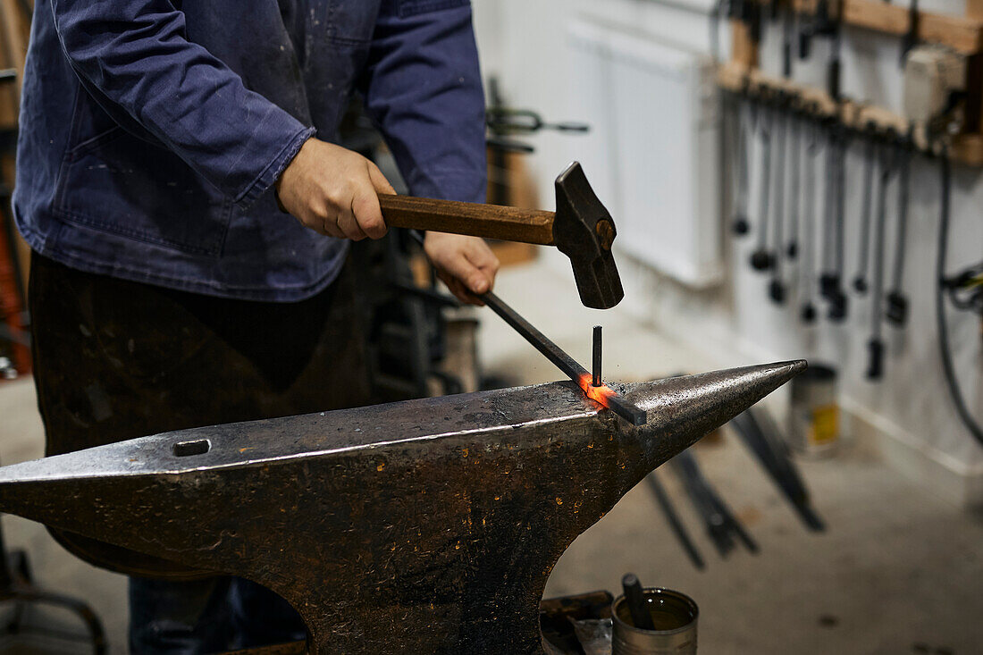 Blacksmith working in his workshop