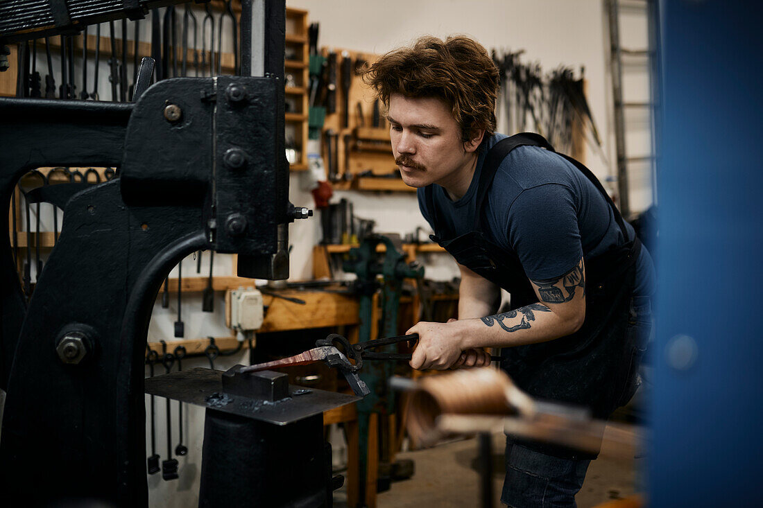 Blacksmith working in his workshop