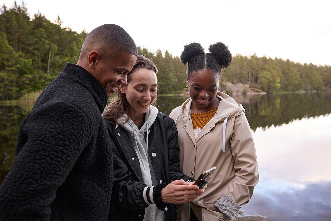 Young friends looking at cell phone