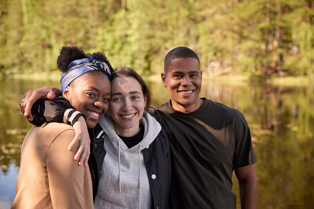 Smiling friends looking at camera