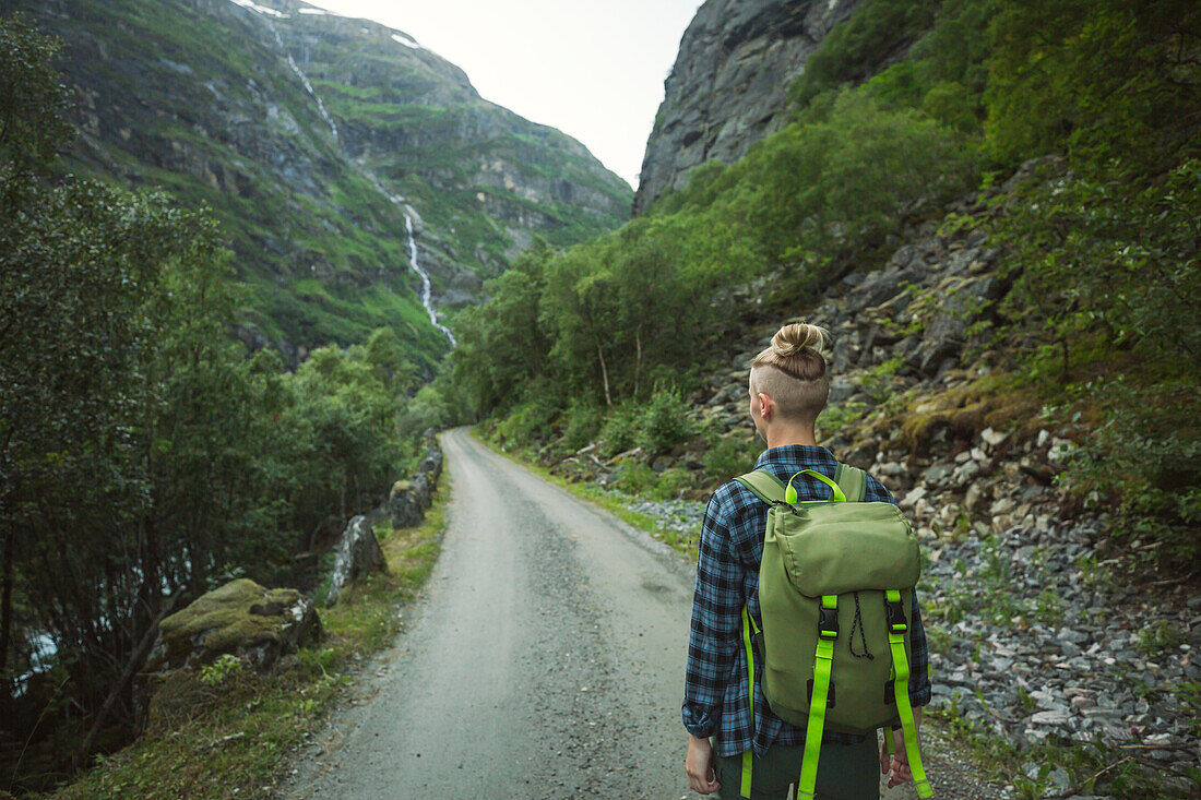 Rear view of woman hiking