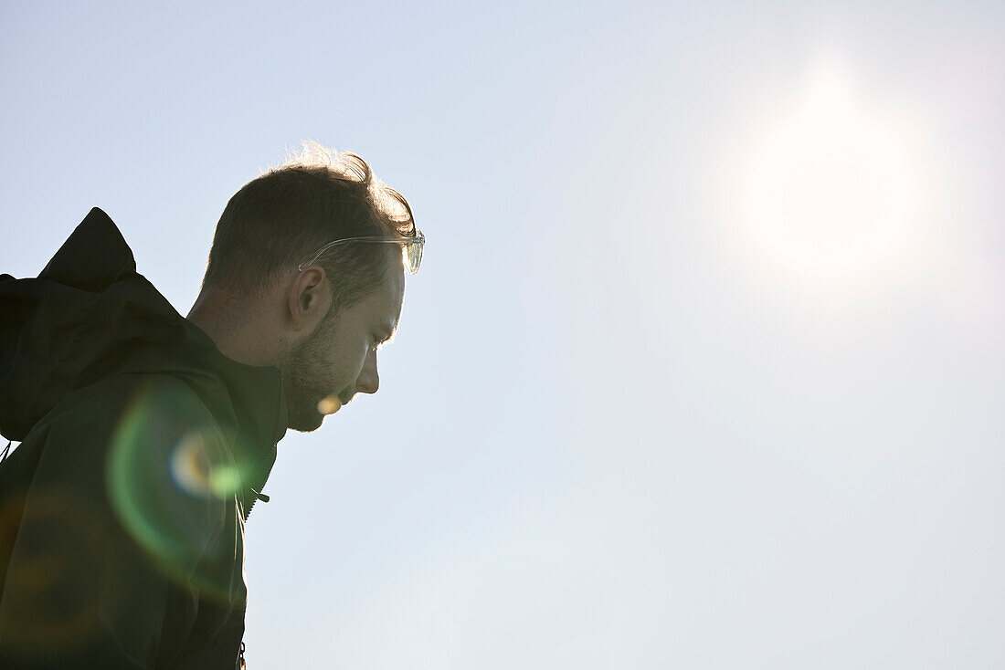 Low angle view of man looking away