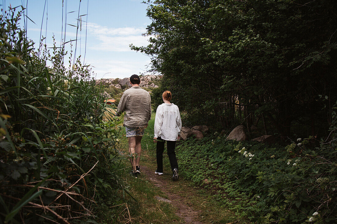 Rear view of couple walking together