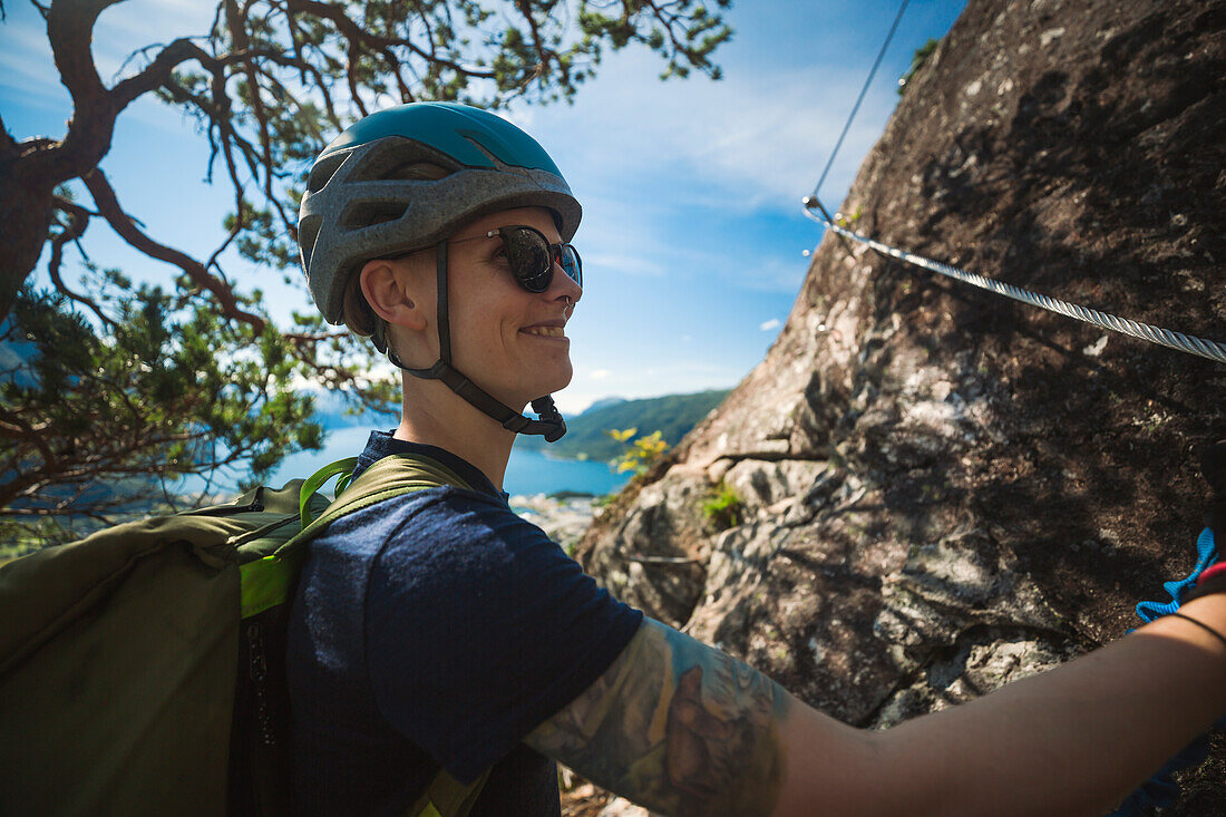 Female rock climber looking away