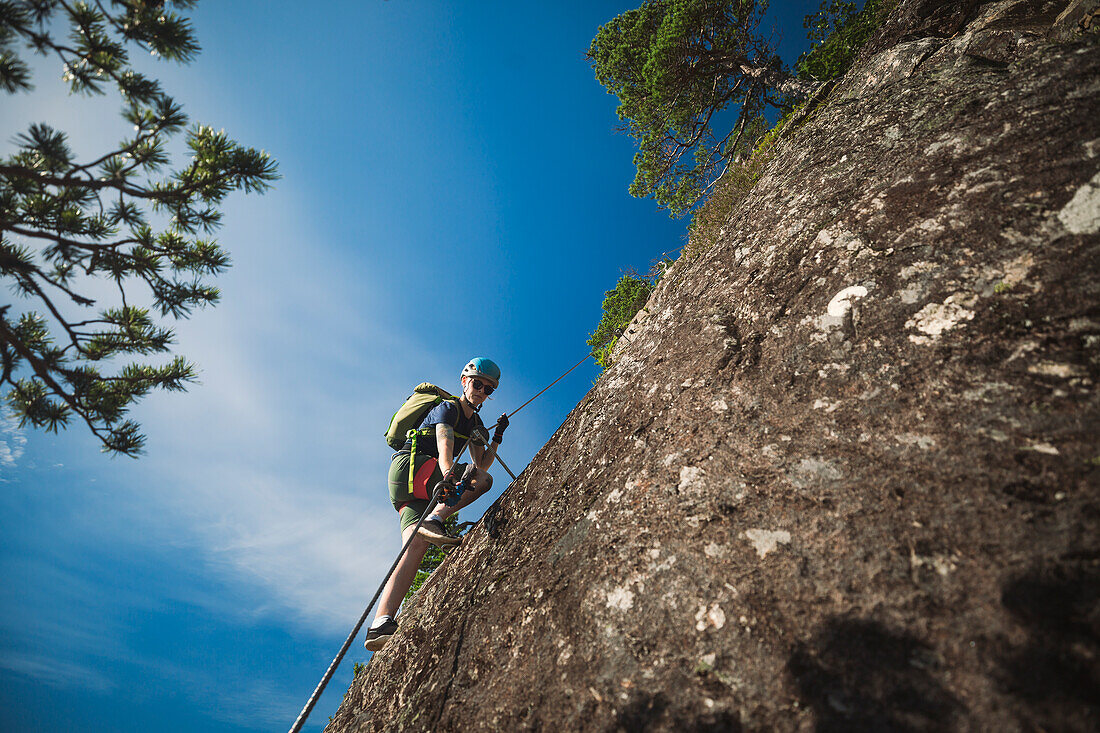 Low angle view of rock climber