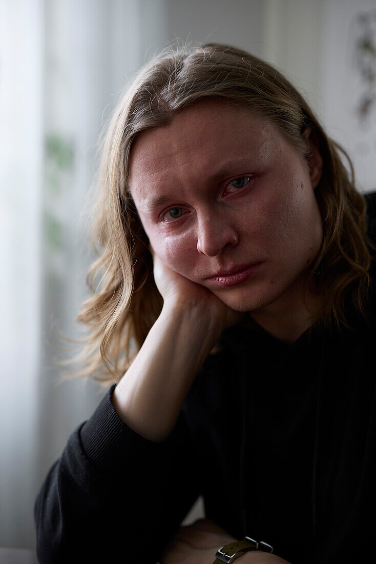 Portrait of crying woman looking at camera