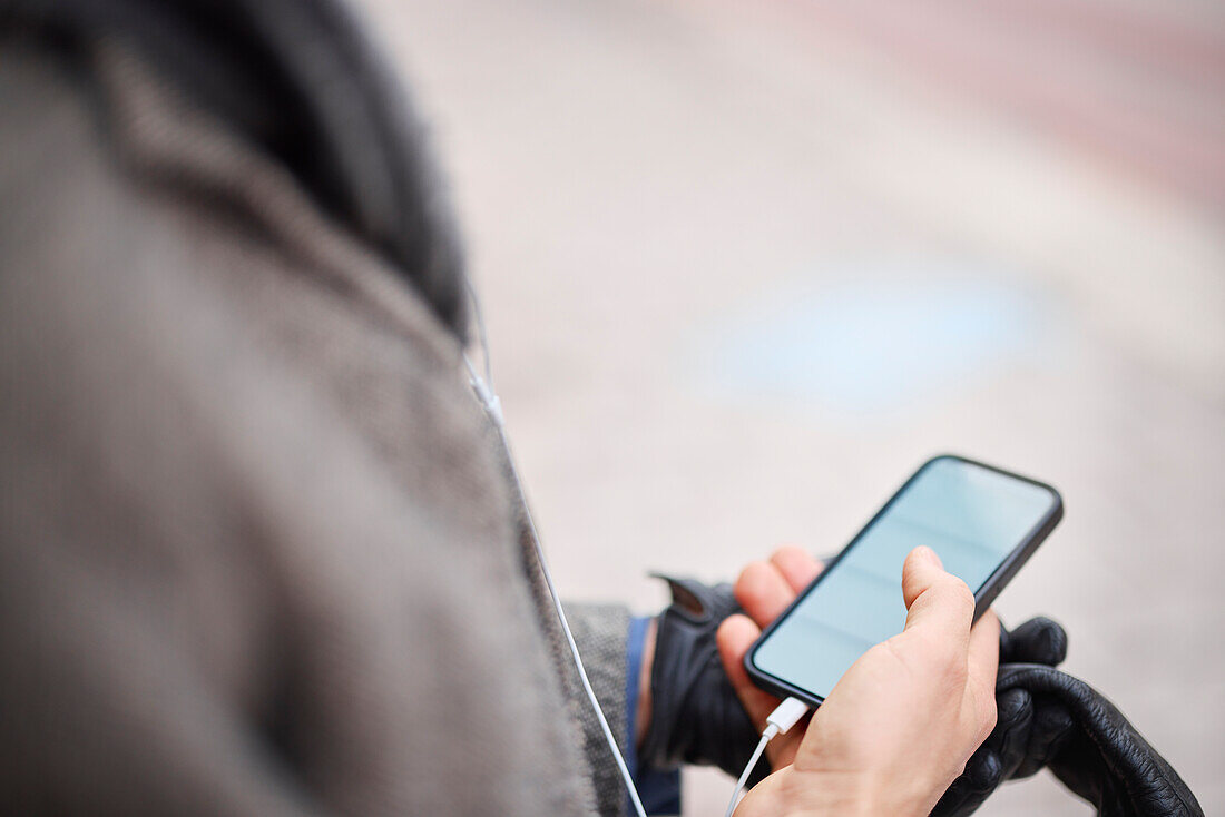 Close-up of man holding smartphone