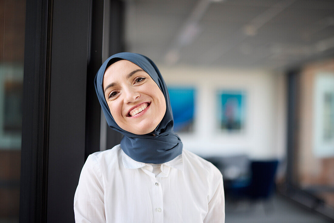 Portrait of smiling businesswoman in hijab