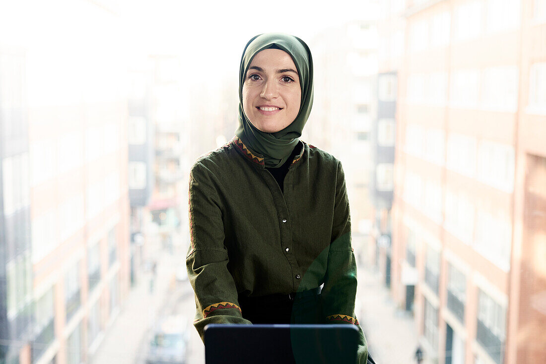 Portrait of smiling businesswoman in hijab