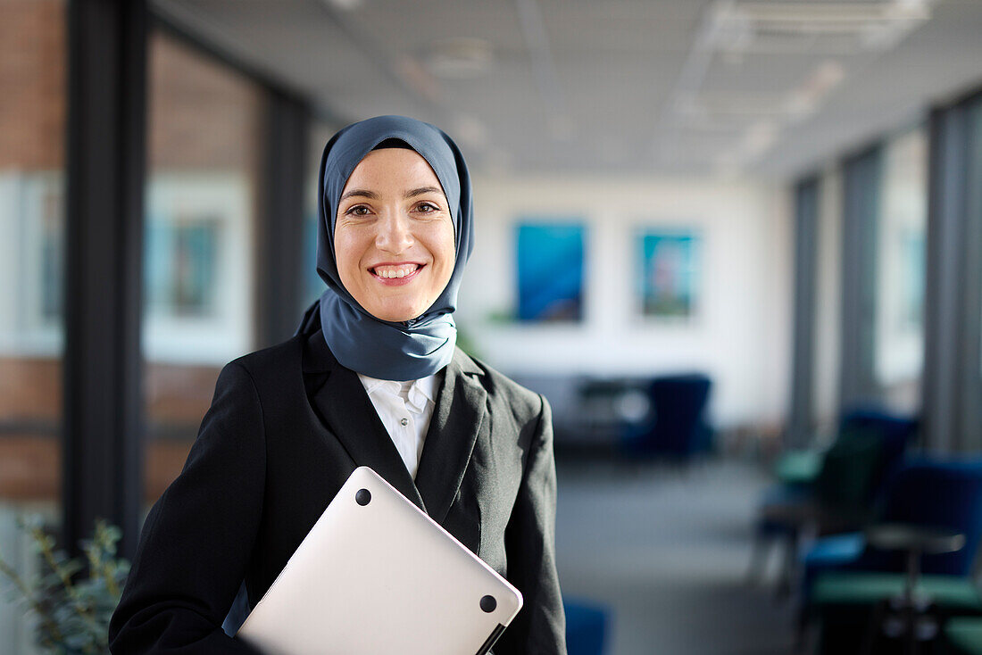 Portrait of smiling businesswoman in hijab